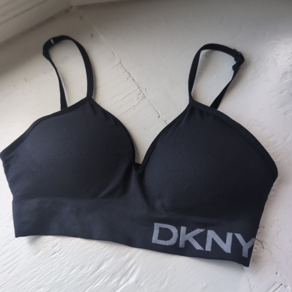 Black DKNY seamless sports bra with adjustable straps and light padding